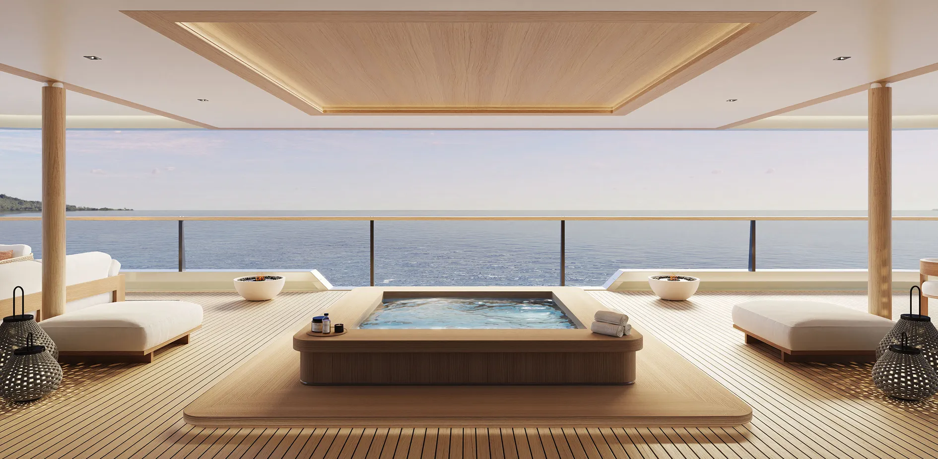 Open-air seaside deck with a central rectangular hot tub, woven lounge chairs, and a calm ocean view.
