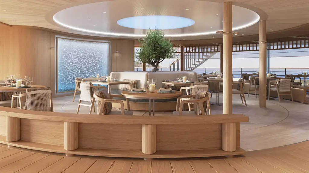 Elegant ocean-view dining room with circular ceiling opening, wooden accents, and a central plant centerpiece set for meals on a ship or resort by the water.