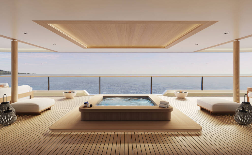 Luxurious open-air terrace over the ocean with a rectangular hot tub at the center and wooden deck seating, horizon visible in the distance.