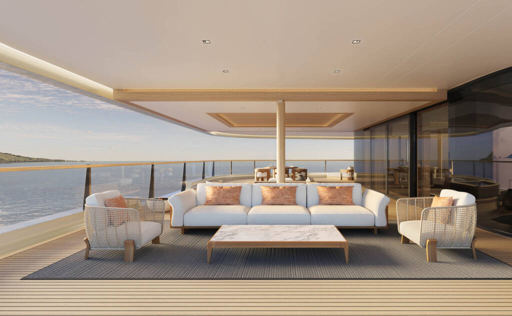 Luxurious yacht deck lounge with white sofas and a marble coffee table overlooking the sea.
