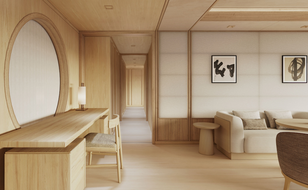 Wood-toned living space with a long desk and chair on the left, a lamp, and a hallway receding in the center-right.
