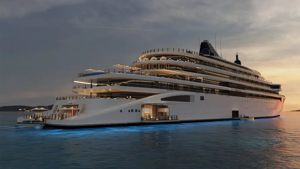 Luxurious multi-deck superyacht anchored on calm blue water at sunset, with warm lights on the hulls and balconies glowing in the evening sky.