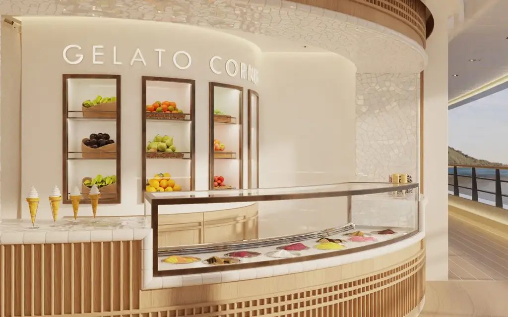 Amangati gelateria 01 1394x1394px | The Luxury Travel Atlas | The Luxury Travel Atlas Gelato Counter with Colorful Cones and Fruit Displays in a Bright, Modern Shop Overlooking a Seaside View.
