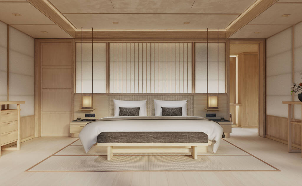 Luxurious wooden bedroom with a king bed, matching nightstands, and warm ambient lighting