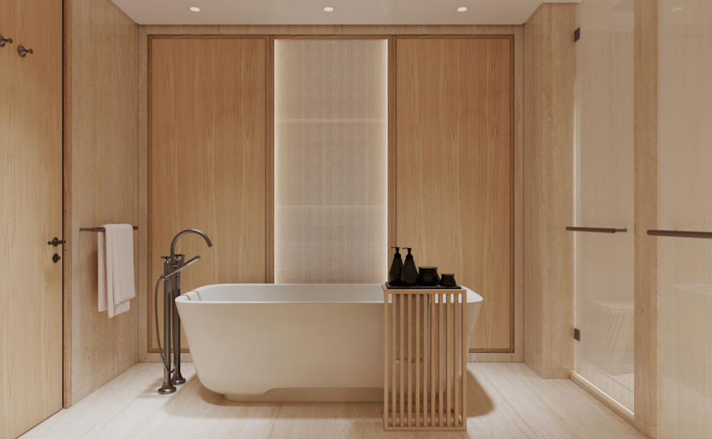Spa-style bathroom with a white freestanding bathtub, wood-paneled walls, towel rack, and a small wooden cart with black toiletries.