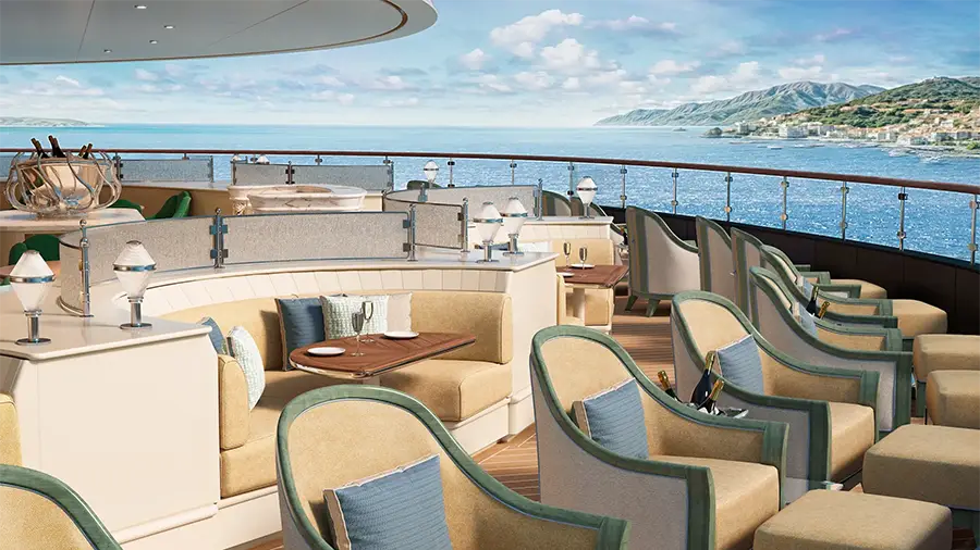 Luxury Yacht Deck Lounge with Beige Seating, Green-trim Chairs, and a Panoramic Ocean View. Overhead Canopy and Glass Railing Frame the Sea Horizon.
