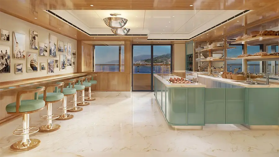 Bright Modern Cafe with a Mint-green Island Bakery Display, Teal Stools Along a Wall of Framed Photos, and an Ocean View Through Large Windows.