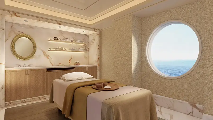 Luxurious Spa Treatment Room with a Massage Bed, Round Window Overlooking the Sea, Marble Walls, and Soft Warm Lighting.