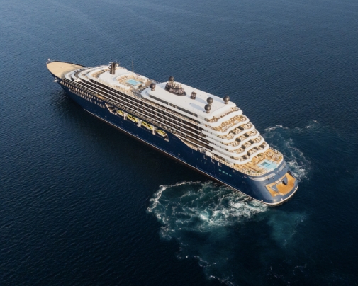a Large Cruise Ship Sailing in Open Ocean, Viewed from Above, with Multiple Decks and a Blue Hull.