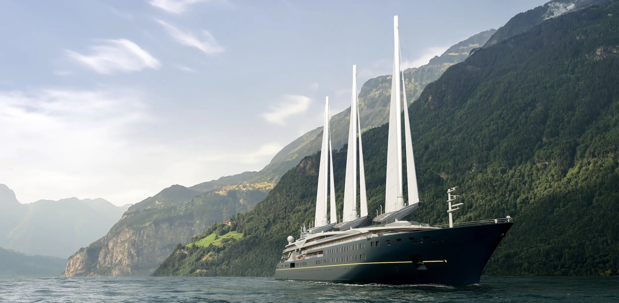 Luxurious multi-masted sailboat on calm water with green mountains in the background, sunlit sky.
