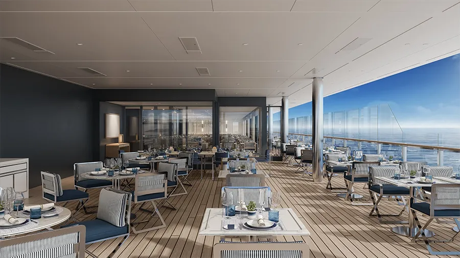 Seaside Rooftop Restaurant on a Wooden Deck with Blue-and-white Seating and an Ocean View.