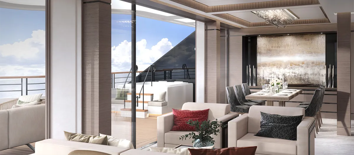 Luxurious open-plan living and dining area with floor-to-ceiling windows and a balcony view of the sea on a sunny day.