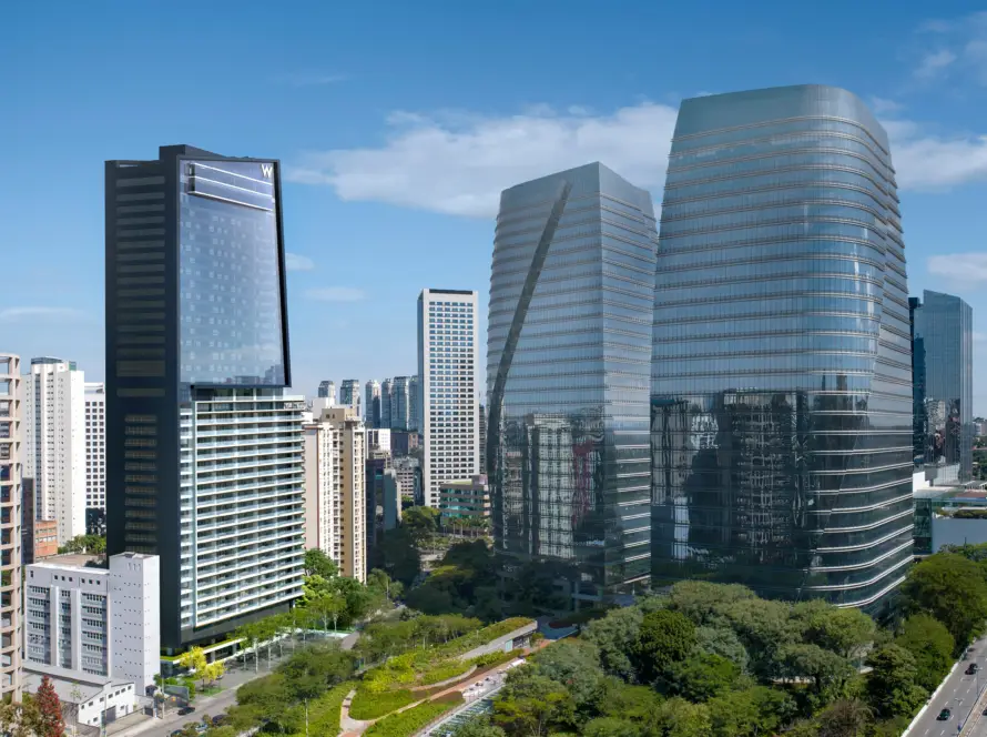 W Sao Paulo Hotel - City Skyline with Tall Glass Skyscrapers Against a Blue Sky, Featuring Modern Office Towers and Greenery Below, from an Elevated View.